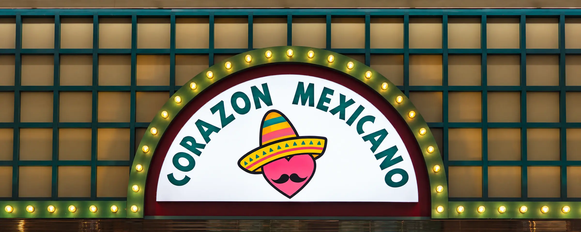The lit Corazón Mexicano sign above the restaurant in Oakwood Mall